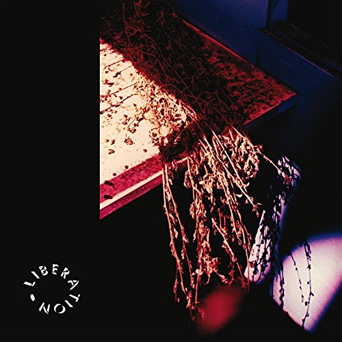 Album cover for “Liberation” featuring a shadowed plant and circular text.