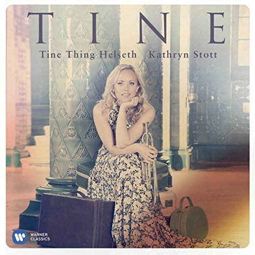 Album cover featuring a woman sitting with a trumpet, surrounded by cases.