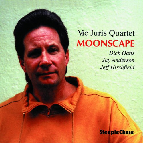 "CD cover featuring a man in an orange jacket, with text 'Vic Juris Quartet Moonscape'."