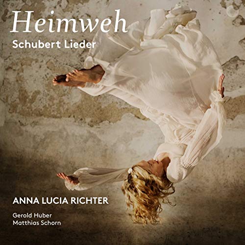 CD cover: woman in white dress suspended against textured wall.