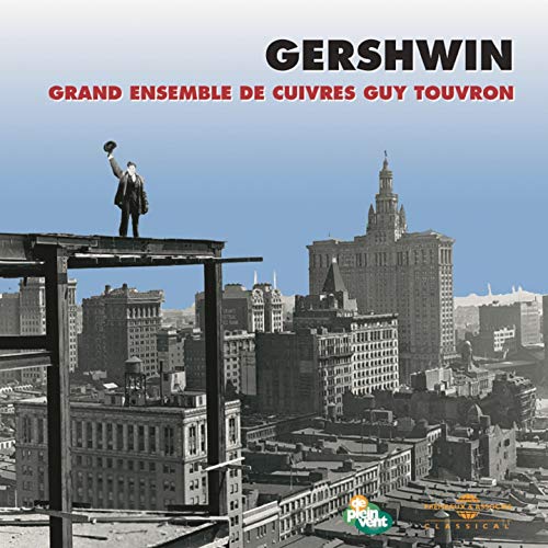 CDS album cover featuringH showing a man onC standing on a city construction beam.