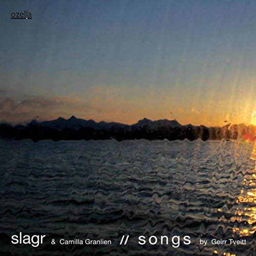 "CD album cover with serene lake scene at sunset and white text."