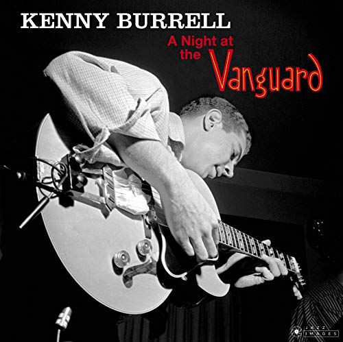 Black and white photo of Kenny Burrell playing a hollow-body electric guitar on stage.