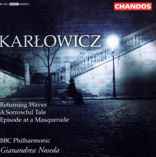 A CD cover featuring a person sitting on steps under a streetlamp at night.