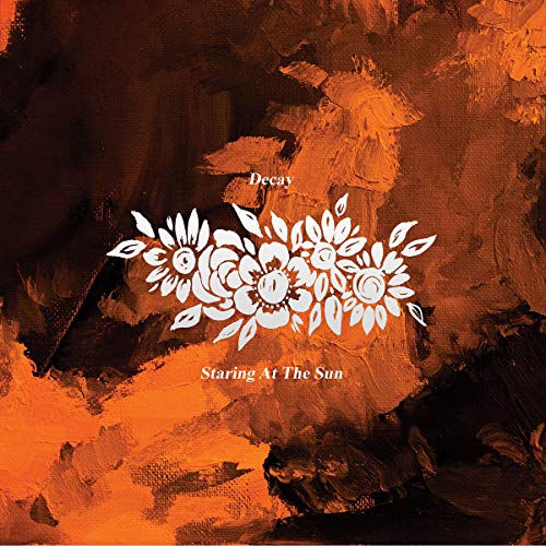 "Orange abstract album cover with white floral design and text 'Decay' and 'Staring At The Sun'."