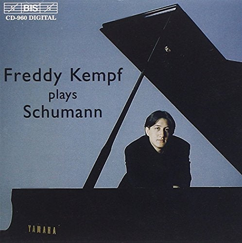 "CD cover featuring a man sitting at a grand piano, with text and logos."