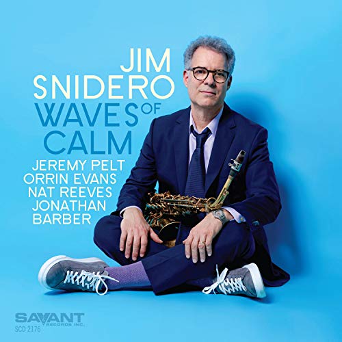 Album cover with man in suit holding saxophone against blue background.