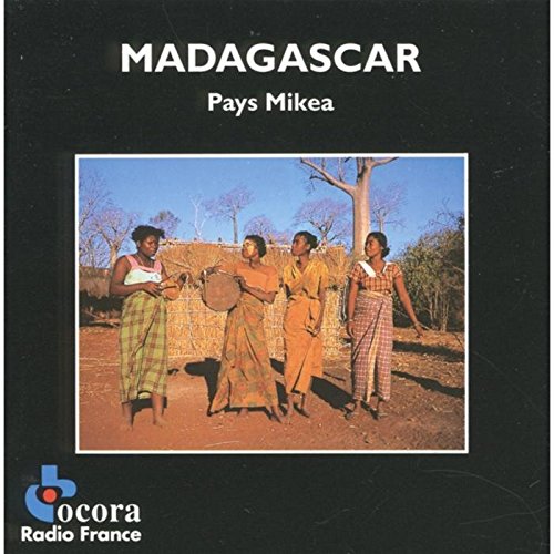 CD cover: four people with musical instruments in a rural landscape.