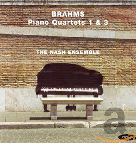 CD cover featuring a piano against a textured brick wall.