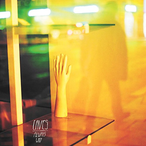 A vinyl record cover featuring a pale arm on a glass shelf.