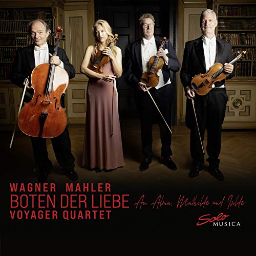Four musicians with string instruments, formal attire, and a bookshelf backdrop.