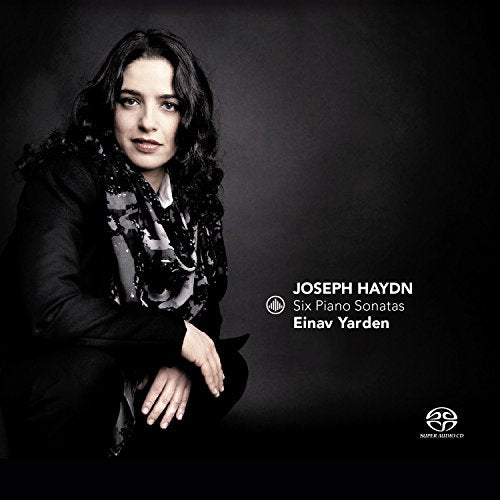 CD cover featuring a woman with dark, curly hair against a dark background.