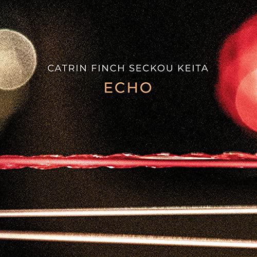 CD cover for Catrin Finch & Seckou Keita’s “Echo”, with red and silver shapes.