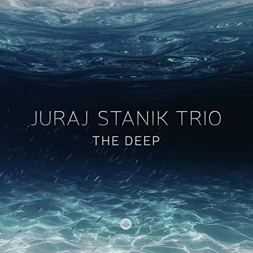 Album cover for Juraj Stanik Trio’s “The Deep” with underwater imagery.
