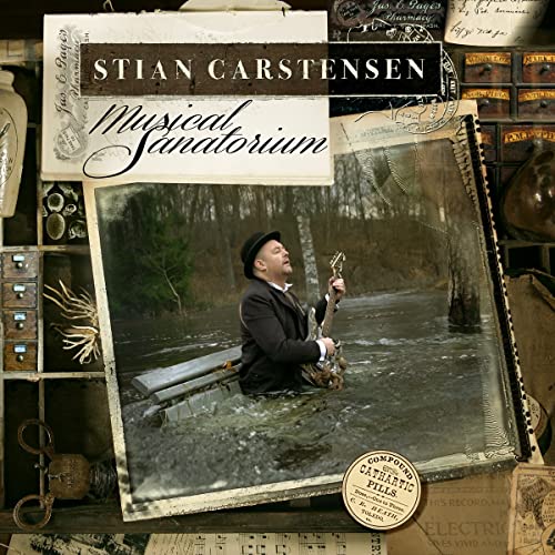 CD cover: man with guitar in a stream, vintage aesthetic.