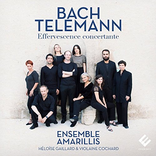 "CD cover featuring a group of nine musicians in dark attire posing together."