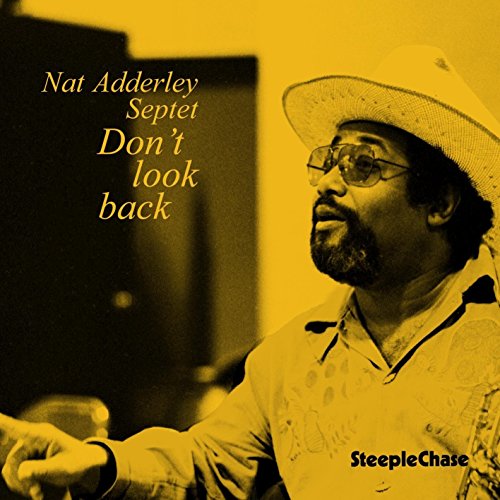 "CD cover featuring a man wearing a hat and glasses, with yellow-toned image."