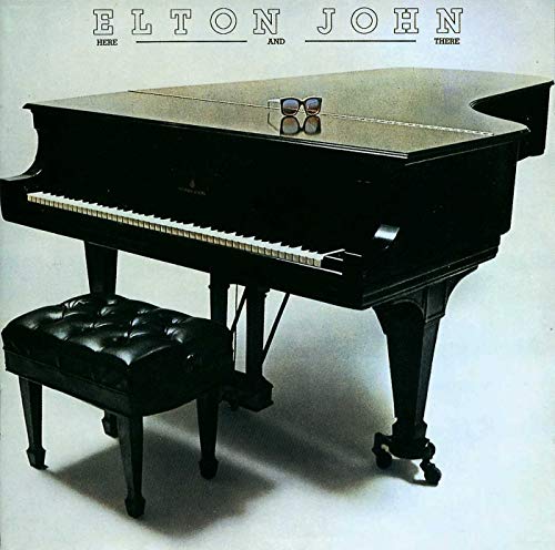Elton John's "Here And There" vinyl album cover featuring a black piano.