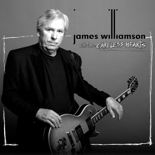 Black and white portrait of James Williamson with a guitar.
