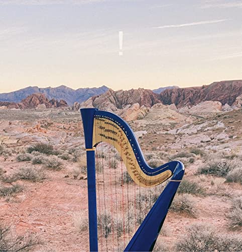 A blue harp in a desert landscape with red rock mountains and a white exclamation.