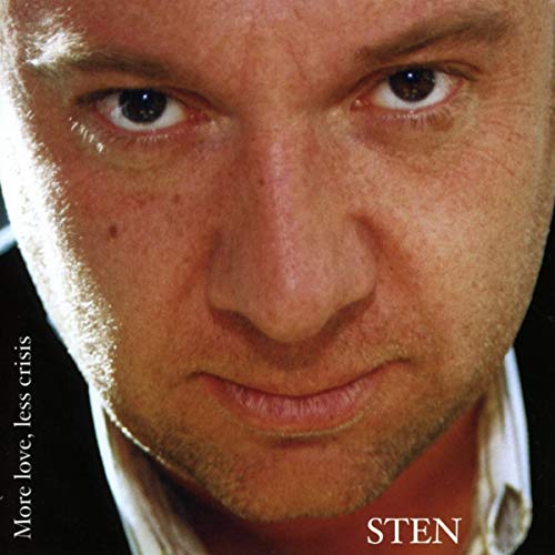 Close-up of a man’s face with album title “More love less crisis.”