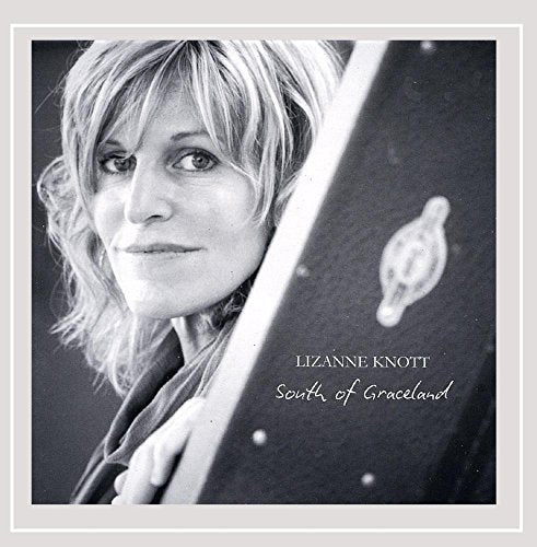 Black and white album cover with a woman's portrait and guitar.
