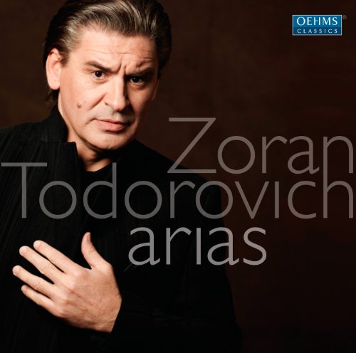 CD cover featuring a man in black with hand on chest, text overlay.