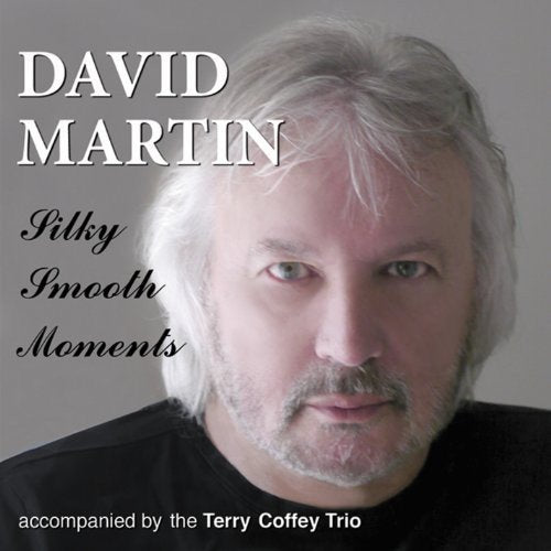"Album cover with a man having white hair and a black shirt."