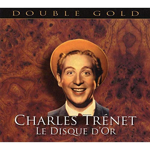 "Album cover with a smiling man in a hat, brown marbled background, and white text."