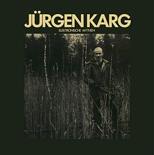 Vinyl album cover with man standing in tall grass and trees.