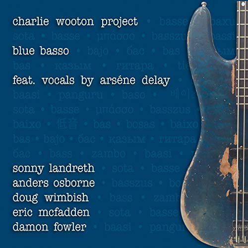 "Blue guitar on a blue background with white text listing the artist and contributors."