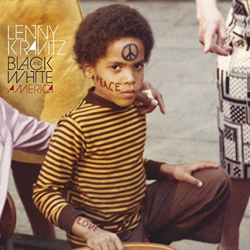 "Album cover: young boy with peace sign on forehead, 'peace' and 'love' written on face and hand."