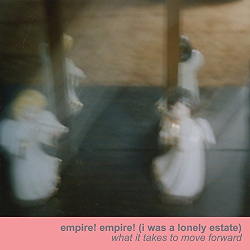 Blurry image of three figures in white robes, pink banner with text at the bottom.