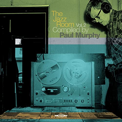 Vinyl record cover featuring a man with headphones and reel-to-reel player.