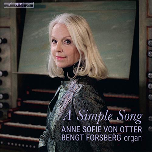 Portrait of Anne Sofie von Otter with an organ in the background.