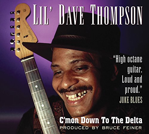 Man in black hat holding guitar, album cover with purple background.