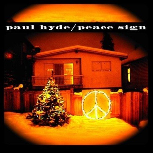 "Album cover with a house, Christmas tree, and a peace sign decoration."