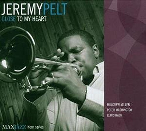 Jeremy Pelt playing trumpet on the CD cover “Close To My Heart”.