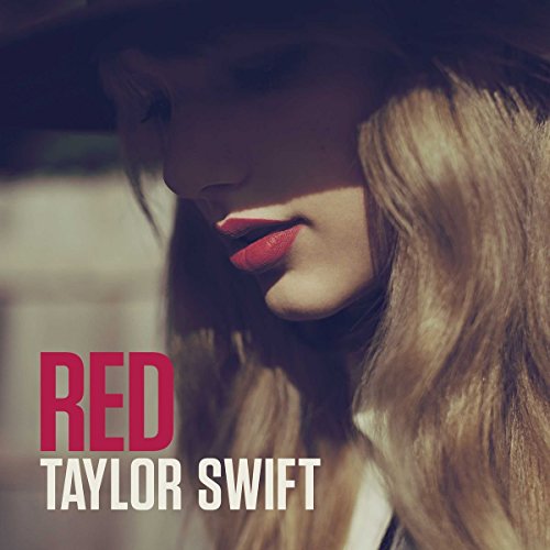 Close-up portrait of Taylor Swift wearing a hat with the text Red Taylor Swift.