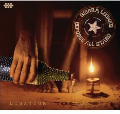 Album cover featuring a foot adorned with rhinestones, a lit candle, and star logo.