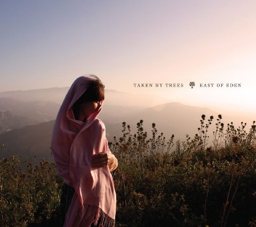 CD cover: person in pink shawl overlooking misty mountains.