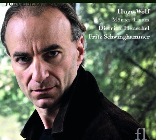 CD cover with a man in a black jacket against a forest background.