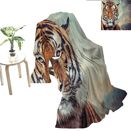 Tiger-printed plush blanket draped over a chair, with a tiger portrait.