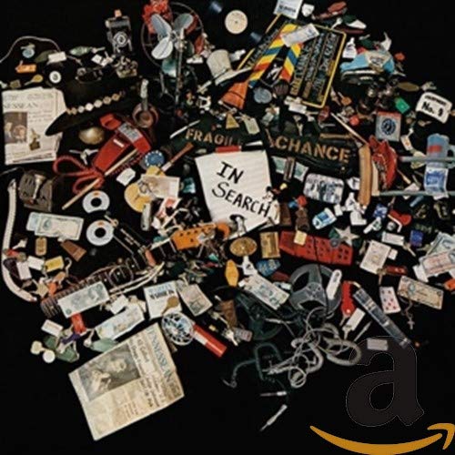 CD cover with a chaotic collage of objects and text "In Search".