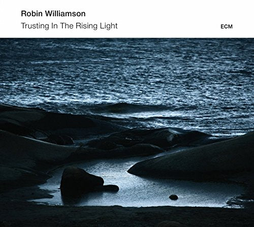 "Album cover with dark, moody seascape and white header featuring artist and title."