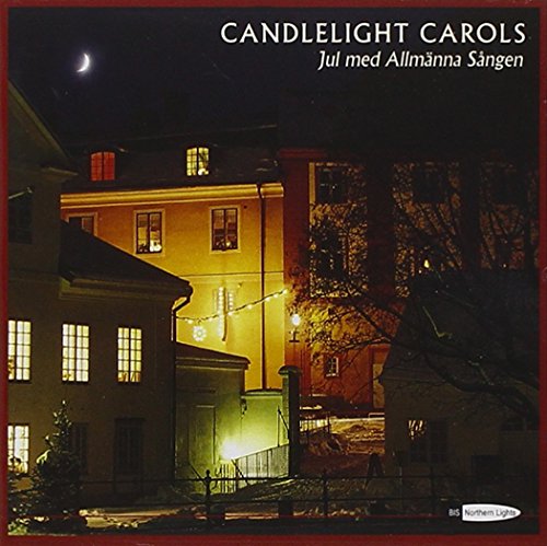 "Album cover with a nighttime scene of lit buildings under a crescent moon."