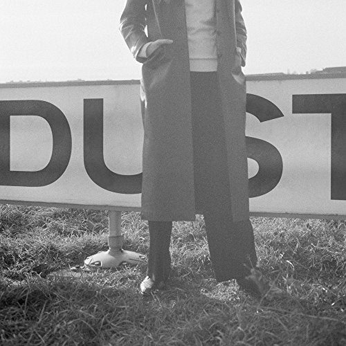 Black and white album cover featuring a person and large “DUST” lettering.