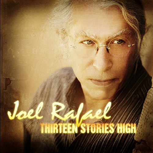 "Album cover featuring a close-up of Joel Rafael's face with yellow text."