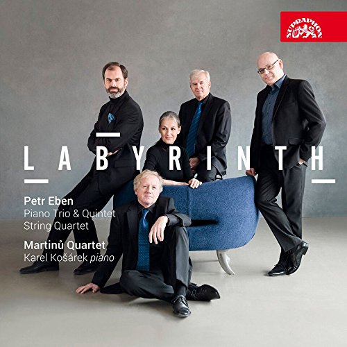 CD cover with five men in black suits posing around a blue chair.