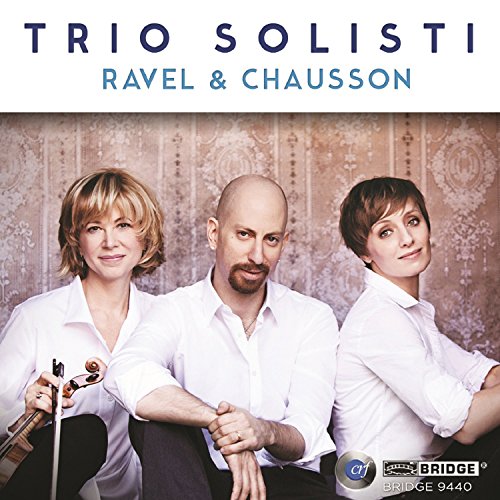 "CD cover with three musicians, one holding a violin, against ornate wallpaper."